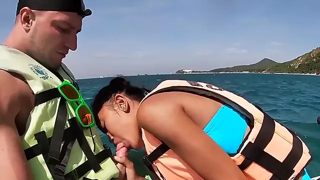 Skinny amateur Thai teen Cherry giving blowjob on a jet ski outdoor